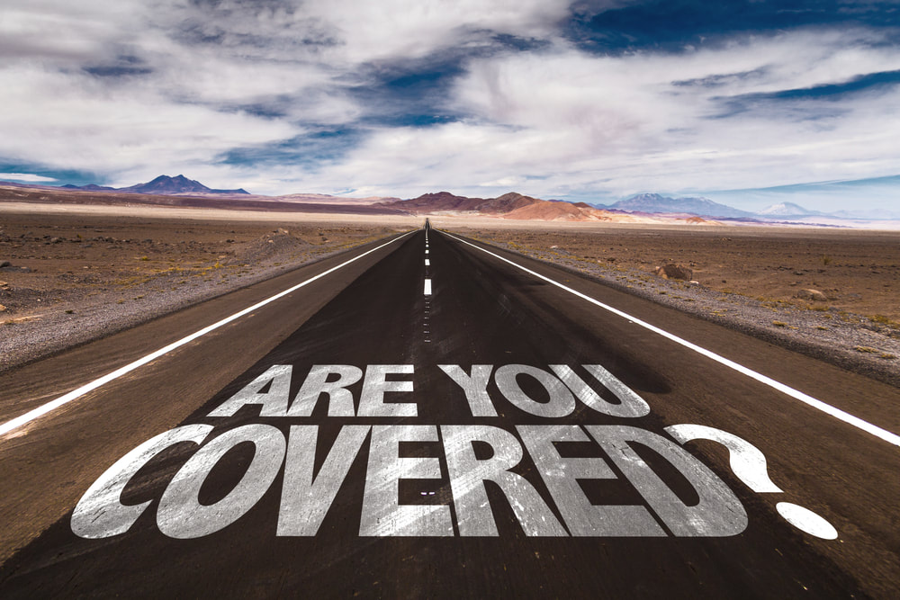 Scenic highway road with text: Are you covered?